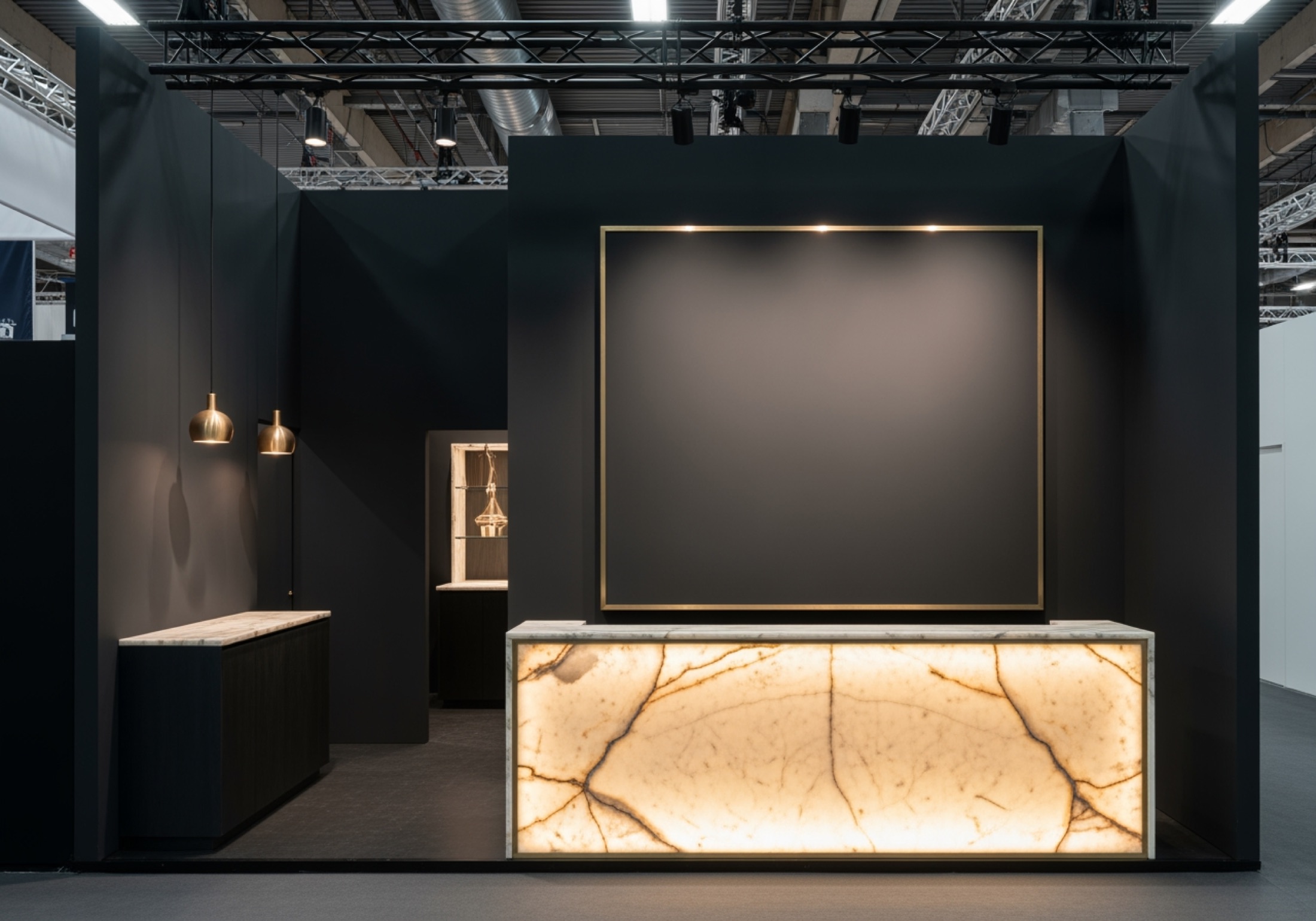 Concept close-up of a backlit onyx reception counter in charcoal and brushed brass
